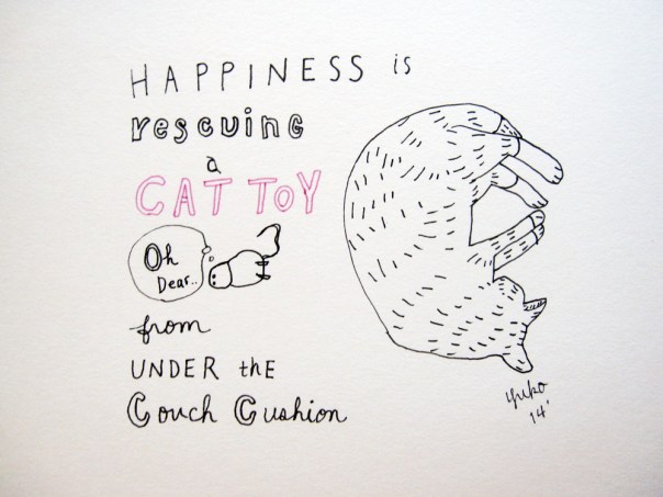 Happiness is rescuing a cat toy from under the couch cushion.